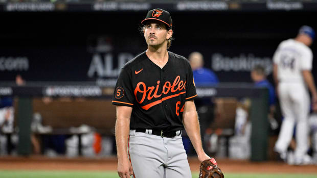 Oct 10, 2023; Arlington, Texas, USA; Baltimore Orioles starting pitcher Dean Kremer (64) is relieved in the second inning against the Texas Rangers during game three of the ALDS for the 2023 MLB playoffs at Globe Life Field. Mandatory Credit: Jerome Miron-USA TODAY Sports